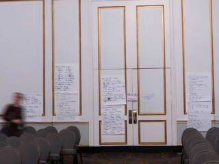 Task and staffing lists on back airwall