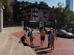 The group gathered in front of the State House