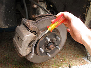 Prying piston back into caliper