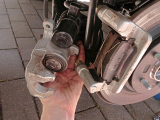 The caliper comes off easily, two bolts