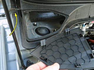 End panel pops out to expose strut; note squirter hose