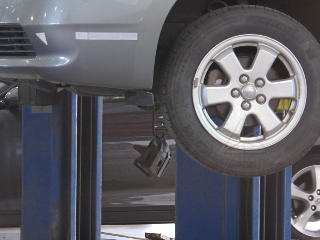 Brake caliper hanging on hose