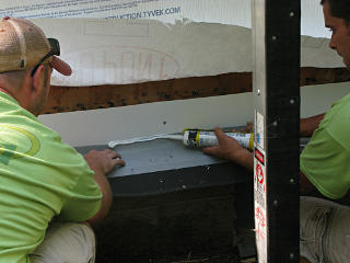 Screen caulked to metal