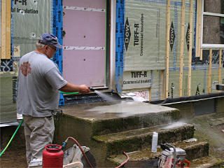 Hosing off first batch of muck