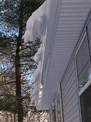 Cornices forming and breaking over gutter