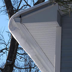 Snow curlicue off shed roof