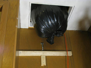 Garbage bag stuck in attic hatch