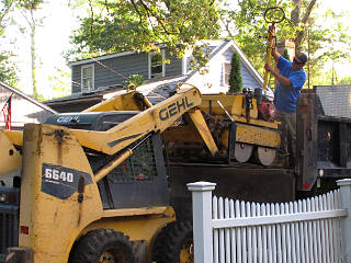 Forking roller off the dump truck