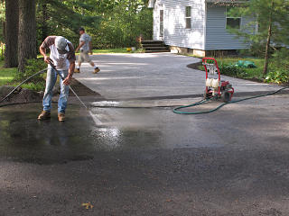 Road cleanup with power-washer