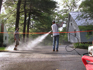 Misting down the driveway
