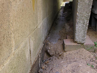 Concrete footer behind side stoop