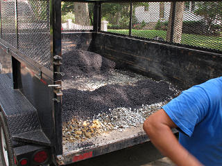 Keeping hot asphalt off trailer bed