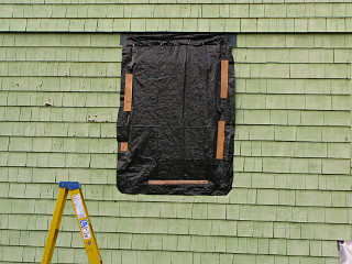 Temporary cover over bathroom window