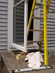 Temporarily holding up storm door