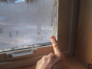 Frozen condensation on window and frame