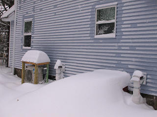 Snow mounded over HVAC stuff