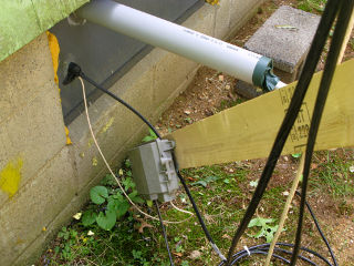 Phone connection box tacked to pole strut