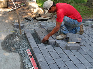 Re-seating pavers on curve
