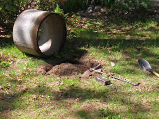 Wishing-well pipe finally dug out