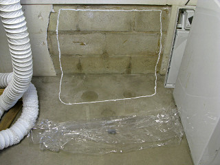 Moisture test patch, impermeable membrane over wall