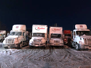 Trucks tucked into an icy yard