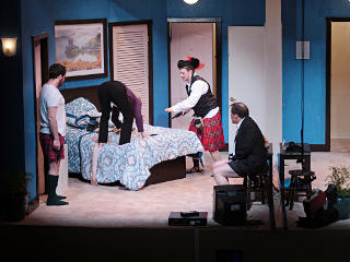 Ms. Meekly climbing over bed