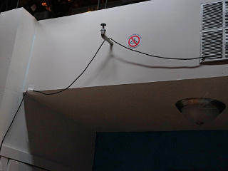 Sprinklers, warning stickers, and klunky video wire