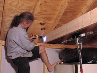 Drilling rafter lead holes through ties