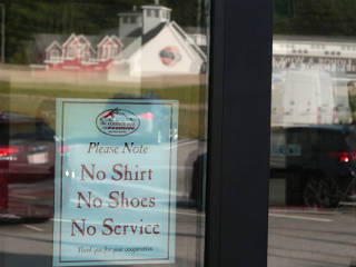 Unwelcoming signs at the Hookset 'Common Man' welcome center