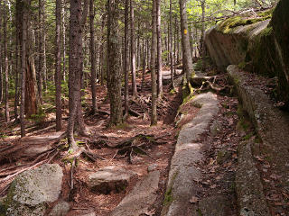 Trail approach along rocky ledge