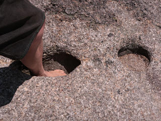 Weird footprint holes in the rock?