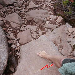 Dusty rocks going down trail