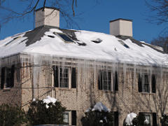Ice dams on a typical poorly insulated hip roof