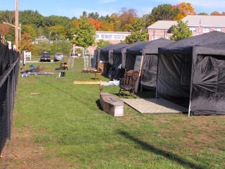 Row of black pop-ups being set up