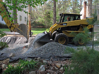 Bobcat helping spread stone