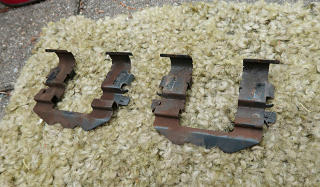 Pad clips removed for cleanout