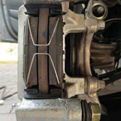 They're supposed to spring the pads apart, but don't do it well