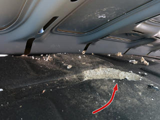 Big chewed-out pit in hood liner