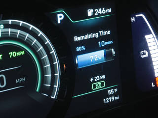 Auto-reduction of charge power near limit