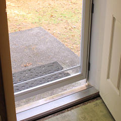 Storm door shimmed tighter