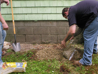 Gravel base for condenser pad