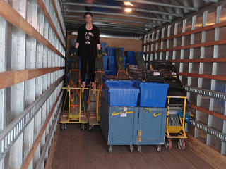 Julia atop the loaded art-show gear