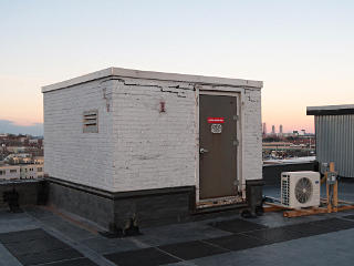 Freight elevator doghouse