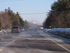 Snow swirling off a dumptruck