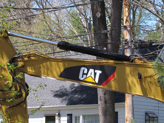 Backhoe bucket right under fiber drop