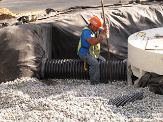 Prying pipe into rubber sleeve