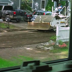 Compaction roller passing in front