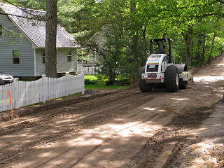 Compactor near house