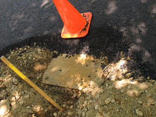 Asphalt spilled into catch-basin