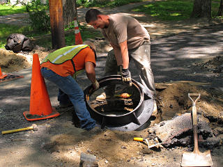 Placing manhole frame
